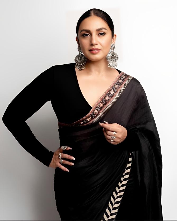Timeless grace in a black saree and full sleeve blouse